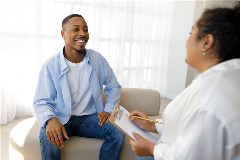 Smiling man experiencing positive therapy outcomes at Alssaro Counseling